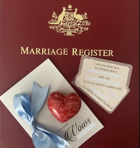 Marriage Ceremony legal requirements
                        symbolised by the Marriage Register, with the
                        Australian Coat of Arms on it, and personal and
                        legal vows cards.